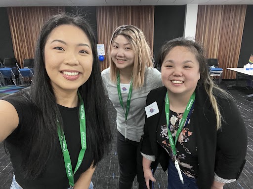 Three women smiling